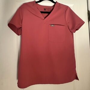 Figs scrub top on pink/purple. Size small